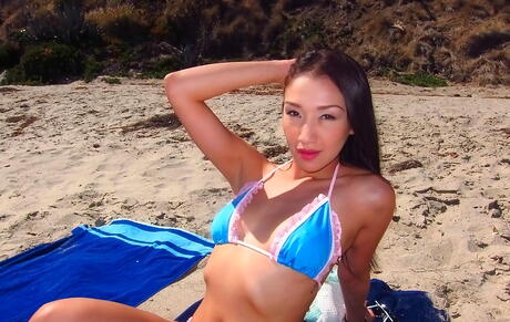 Shapely oriental brunette teen Vicki Chase baring big boobies and hot butt on the beach