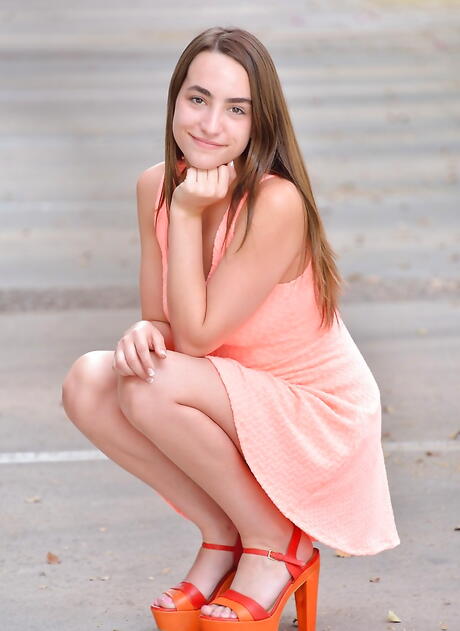 Slim american brunette teen Jeri Lynn baring big hooters and stuffing her pussy with a toy outdoor