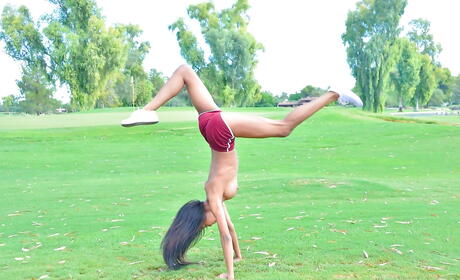 Foxy american brunette teen Nia Nacci in fancy shorts showing big hooters and ass outside