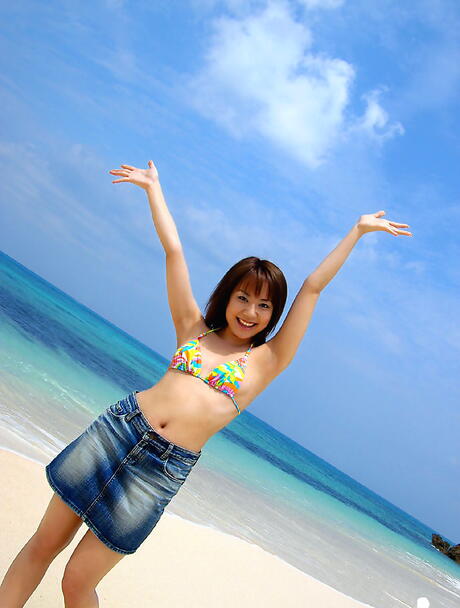 Very attractive japanese young Chikaho Ito in fancy bikini exhibiting tiny tits and sexy ass at beach