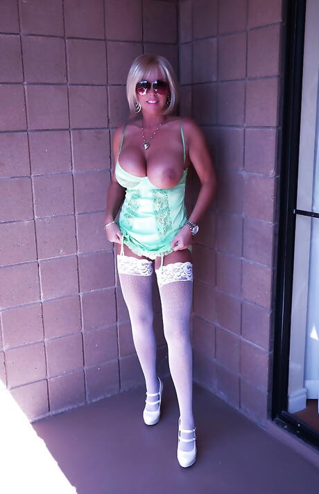 Sexy american blonde wife Sandra Otterson in sexy stockings bares big titties and sexy butt 