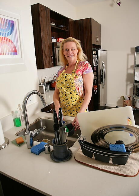 Superb blonde older Shasha exhibits big titties and sexy ass in kitchen