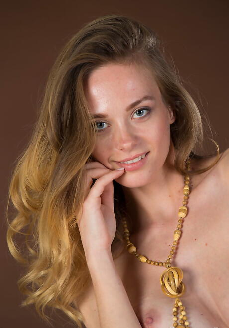 Slim young Irene denudes big hooters and spreads her legs 