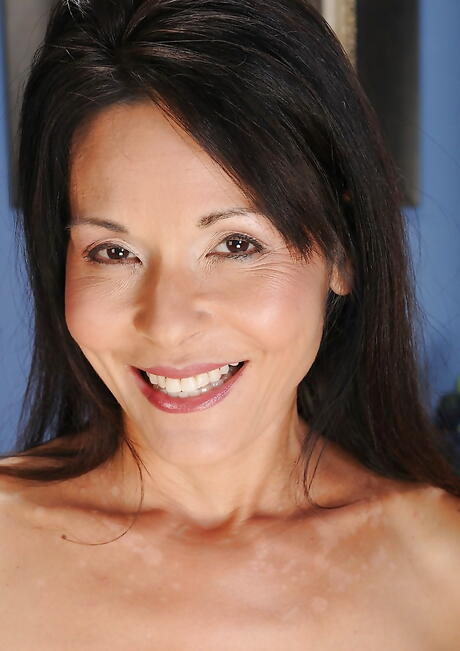 Very attractive british older Trudy Lewis in fancy shorts reveals big boobs and spreads her legs 