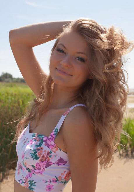 Excellent blond young Patritcy in sexy skirt shows tiny tits and hairy pussy on the beach