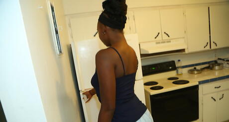 Tempting black milf Naomi Gamble in skirt denudes big boobs and hot butt 