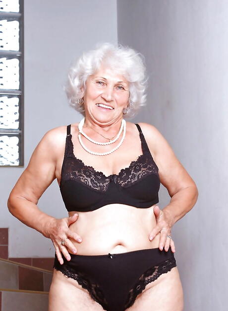 Seductive grandma Betty in hot underwear baring big boobies and loving sex toy 