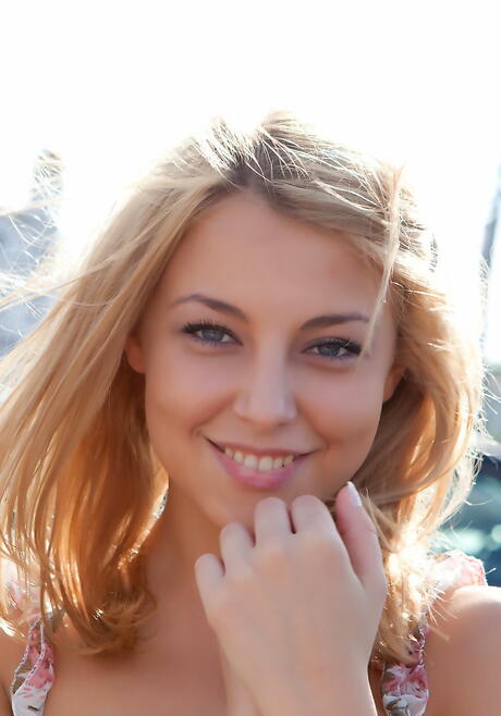 Very attractive blond youthful Nikia A exhibits her ass and shaved pussy outdoor