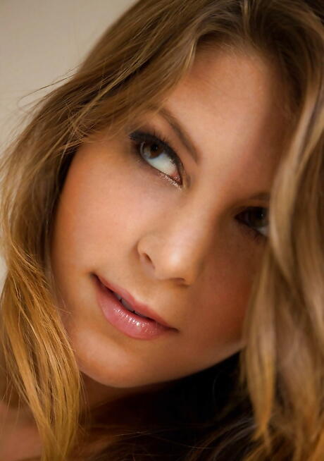 Enchanting american babe Amber Sym in hot undies denudes big titties and butt 