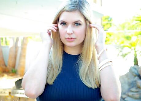 Attractive blonde babe Danielle Delaunay in skirt revealing her ass and hairy pussy at pool