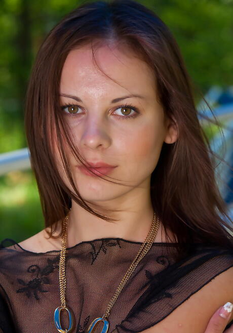 Very attractive dark-haired teen Bogdana B uncovers small tits and spreads her legs outside