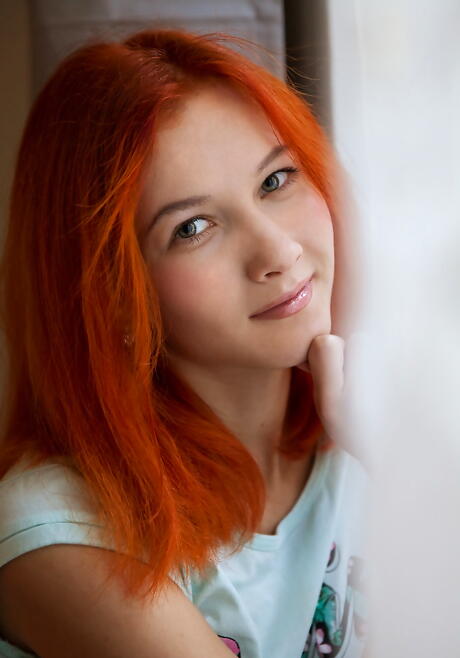 Luscious redhead young Ambre bares small tits and masturbates 