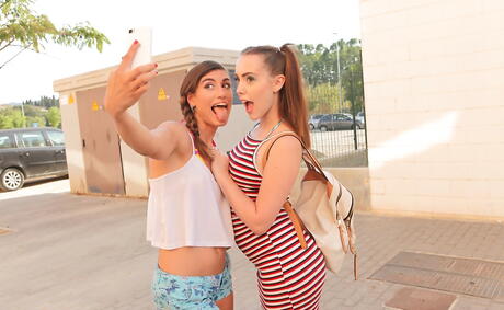 Sultry women Zoe Doll and Julia Roca in shorts have some lesbian fun near the pool