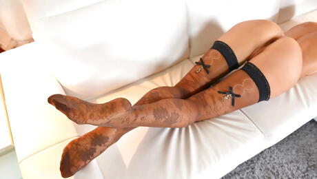 Stunning brunette teen Lorena in stockings makes some hot foot fetish action 