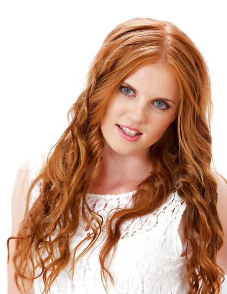 Sexy redhead babe Jennet V in lingerie exhibits her ass and spreads her legs 