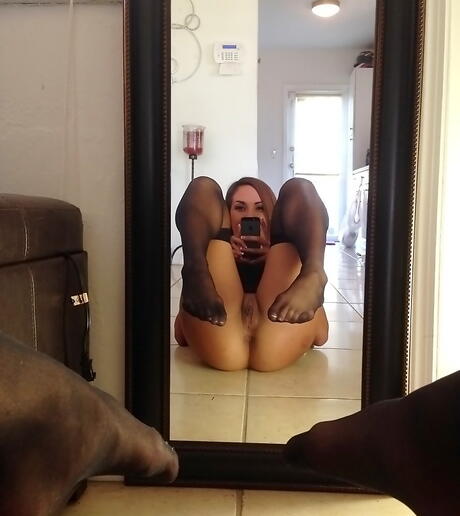 Excellent american dark-haired Abbi Roads in hot stockings exhibits her ass and spreads her legs 