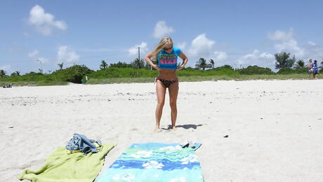 Very attractive american milf Britney Brooks revealing big boobs and undressing on the beach