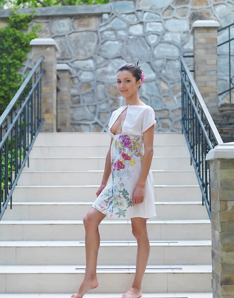 Slender dark hair youthful Divina A shows tiny tits and spreads her legs outdoor