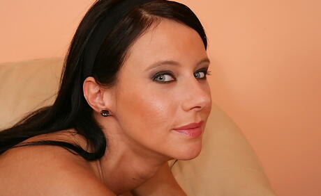 Charming brunette milf Enza shows big tits and masturbates 