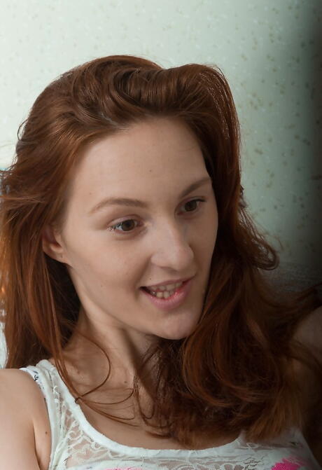 Shapely red-haired cutie Ariadna in lingerie likes some hot foot fetish 