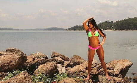 Very attractive latin babe Leticia bares big boobs and butt at beach