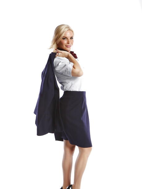 Seductive american blond milf Diamond Foxxx exposes big tits while stripping out 