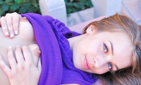 Foxy brunette youthful Sofia Sutra exhibiting small tits and bald pussy outside