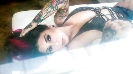 Enchanting american milf Joanna Angel bares big hooters and spreads her legs 