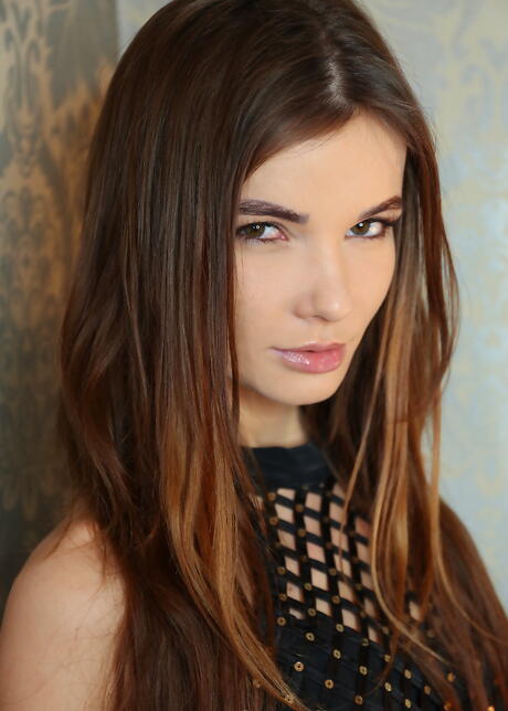 Slender brunette teen Brit in lingerie exposing her butt and bald pussy 