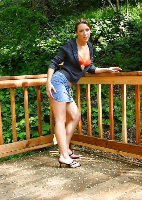 Sexy young Sabrina in sexy underwear exhibits big titties and spreads her legs outside