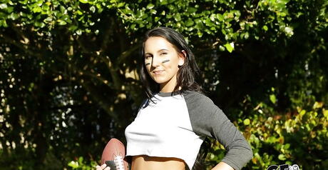 Enchanting brunette babe Alicia Tease in fancy shorts exhibits big tits and sexy butt outdoor