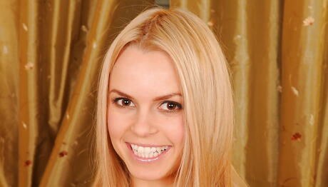 Slim blonde teen Sabrinka revealing tiny tits and shaved pussy 