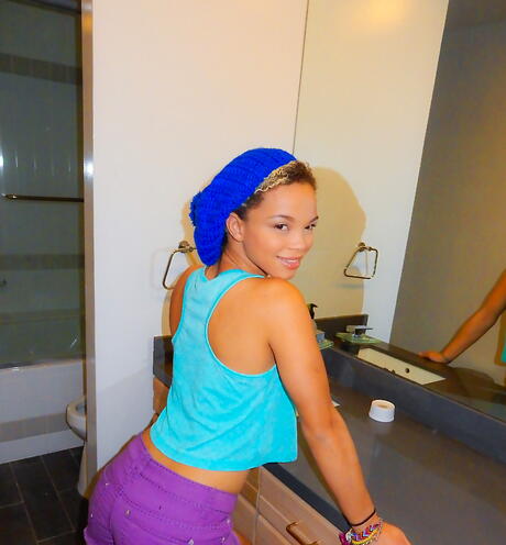 Superb black amateur Ashley Luvbug in fancy shorts baring her butt and shaved pussy 