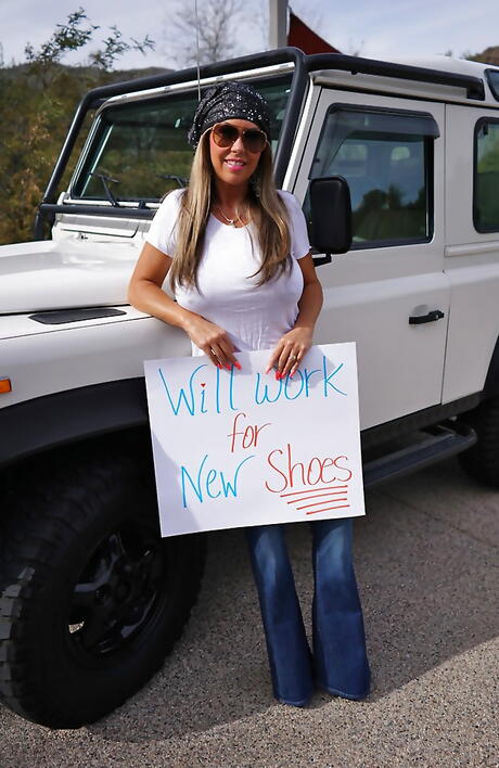 Adorable american blonde homemaker Sandra Otterson in tight jeans exhibiting big titties and hot butt outside