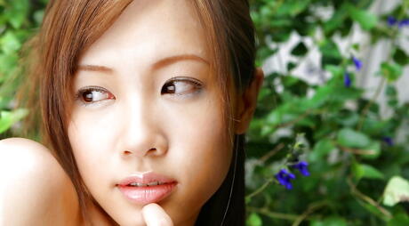 Svelte japanese youthful Reika Shina exposes small tits and spreads her legs outdoor