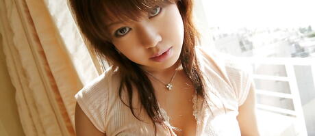 Shapely japanese youthful Chise exhibits big tits and pussy 