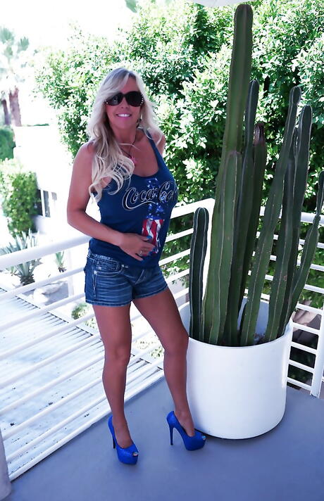 Enchanting american blonde housewife Sandra Otterson in fancy shorts revealing big boobies and hot ass outdoor