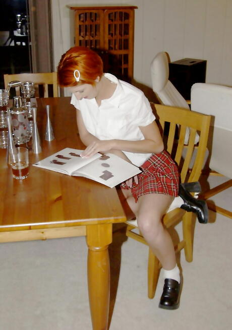 Stunning redheaded teen Lydia West exposing tiny tits and masturbating in kitchen