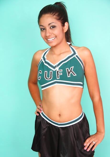 Very attractive latina teen Ruby Rayes in skirt baring small tits and pussy 