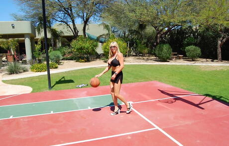 Hot american wife Sandra Otterson showing big knockers and butt outside