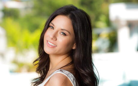 Hot american dark-haired porn star Shyla Jennings in sexy skirt reveals tiny tits and sexy butt outside