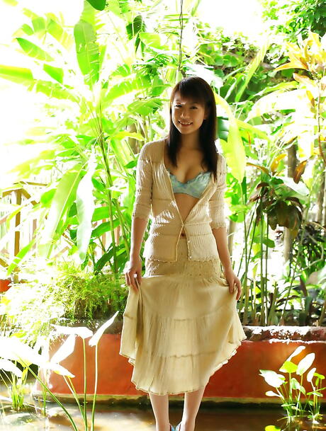 Very attractive japanese Kurumi Morishita in sexy posing on camera outdoor