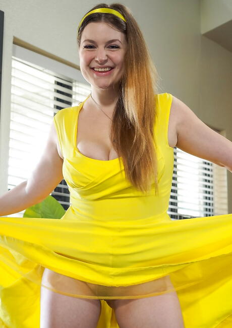 Tempting red-haired cutie Danielle Delaunay in skirt exhibiting big titties and sissy 