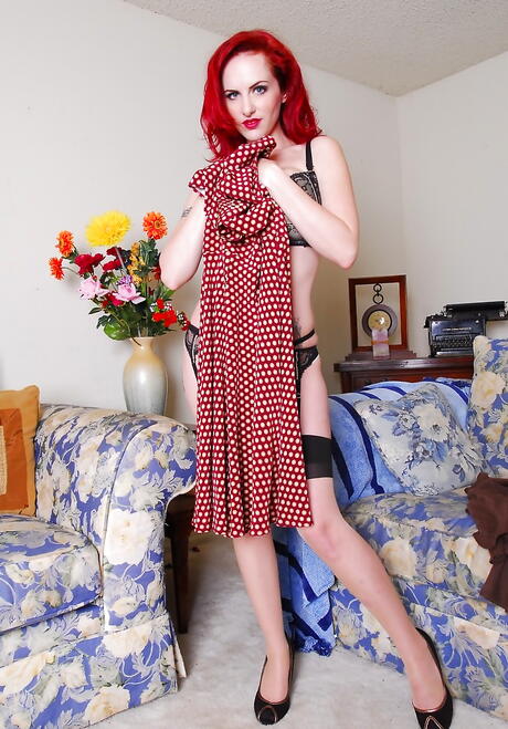 Enticing redheaded babe Berlin in underwear exposing big titties and pussy 