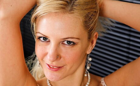 Alluring blonde milf Laurita in hot underwear baring big boobies and spreading her legs 