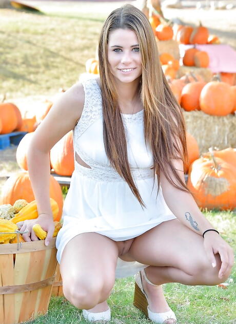 Rangy redheaded teen Aveline Kristie in sexy skirt revealing big boobs and spreading her legs outside