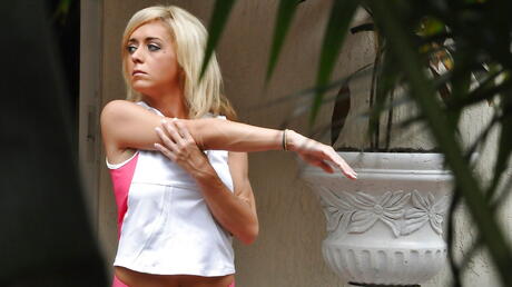 Very attractive blonde babe Jewel Jensen in fancy shorts revealing big boobies and butt near the pool