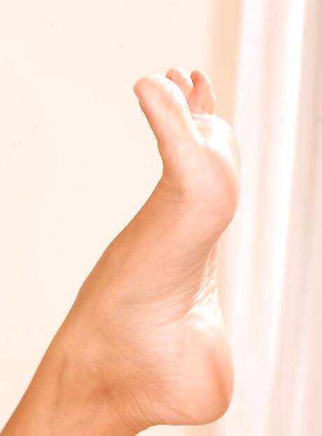 Very attractive redhead milf Veronica Da Souza in uniform makes some foot fetish 