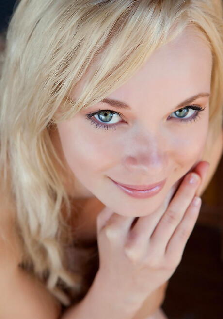 Sylphlike blonde young Feeona A uncovering tiny tits and spreading her legs outdoor