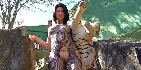 Appealing latin babe Britney Bitch shows big hooters and jerks off outside